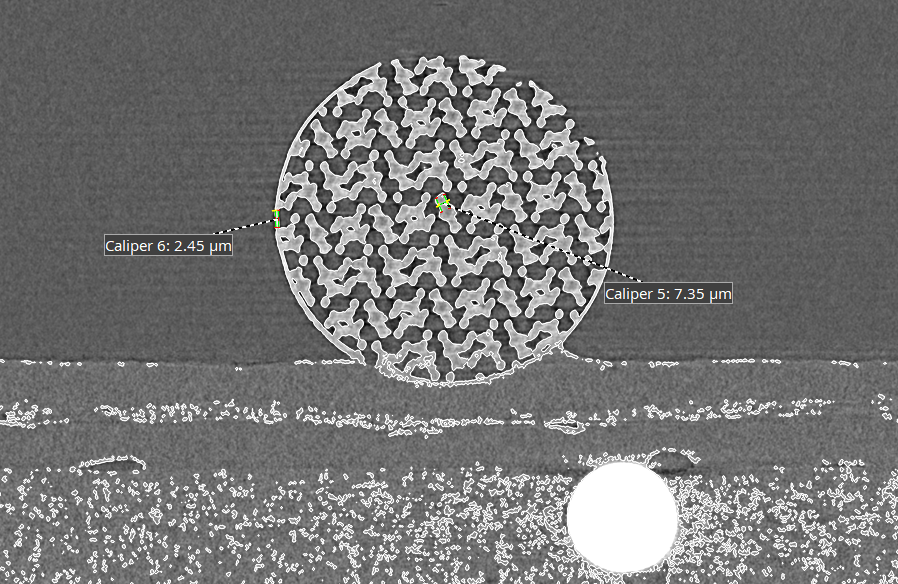 A cross-sectional CT slice of a 3D printed ball with dimensional measurements.